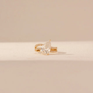 Front view of Pear-Shaped Solitaire Diamond Ring in 14KT Yellow Gold, featuring a pear-cut lab-grown diamond and pavé bands.