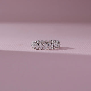 Front view of Multi Shape Diamond Band Ring in 14KT White Gold, featuring a mix of round and fancy-cut lab grown diamonds in clustered settings. Set on a pink backdrop, the design highlights bold sparkle and texture.
