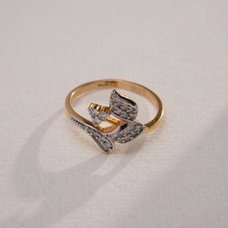 Close-up top view of Golden Leaf Cluster Diamond Ring in 14KT Yellow Gold, featuring delicate leaf motifs with EF VVS round diamonds, blending natural elegance with brilliance.