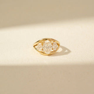 Front view of Three-Stone Oval Diamond Ring in 14KT Yellow Gold, featuring an oval centre diamond and two side stones.