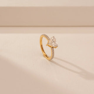 Angled view of Delicate Heart Solitaire Diamond Ring in 14KT Yellow Gold, featuring a heart-cut lab-grown diamond.