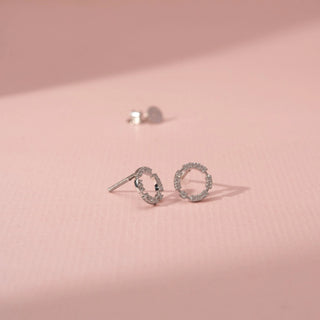 Angled view of Circular Diamond Earrings in 14KT White Gold, featuring round lab-grown diamonds in a delicate halo design.