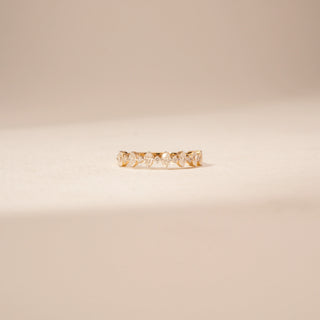 Front view of a 14KT Yellow Gold diamond ring, featuring alternating marquise and round diamonds along the band.