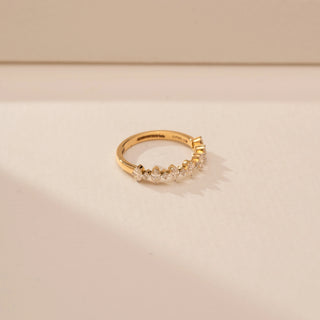 Side view of a 14KT Yellow Gold diamond ring, featuring alternating marquise and round diamonds along the band.