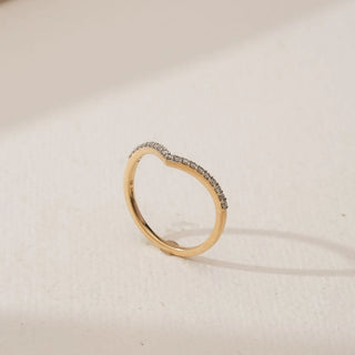 Side angled view of Elegant Gold Chevron Diamond Band in yellow gold, showcasing round lab-grown diamonds set along a delicate V-shaped chevron curve, displayed on a neutral background.