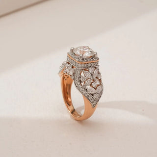 Side angled view of Ornate Vintage Halo Diamond Ring in rose gold, highlighting a raised round lab-grown centre diamond with square halo and intricate marquise floral diamond detailing.
