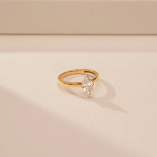 Side view of a 14KT Yellow Gold diamond ring with two marquise-shaped diamonds arranged vertically in a four-prong setting.