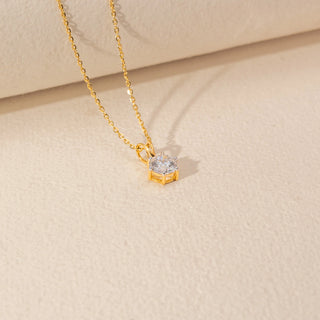 Angled view of Round Solitaire Diamond Pendant in 14KT Yellow Gold, featuring a round lab-grown diamond on a fine gold chain.