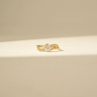 Front view of Round Solitaire Diamond Ring in 14KT Yellow Gold, featuring a round diamond and double curved pavé bands.