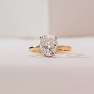 Close-up front view of Modern Elongated Cushion Diamond Ring in 14KT yellow gold, featuring a large elongated cushion-cut centre diamond in a hidden halo setting.