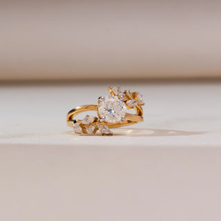 Front view of Floral Cluster Round Diamond Ring in 14KT yellow gold, featuring a round centre diamond with marquise-shaped cluster accents on a polished band.