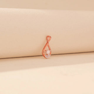 Side view of Teardrop Diamond Pendant in 14KT Rose Gold, featuring a round lab-grown diamond and pavé-set diamonds.