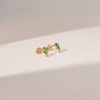 Side view of Emerald Diamond Earrings in 14KT Yellow Gold, featuring baguette-cut green gemstones and round lab-grown diamonds.