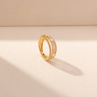 Angled view of Diamond Band Ring in 14KT Yellow Gold, featuring baguette and round diamonds with pavé borders.