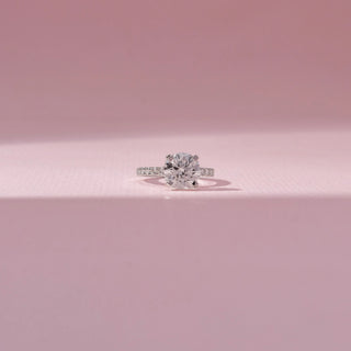 Front view of 14 KT White Gold Round Solitaire Diamond Ring , featuring a round lab-grown diamond and pavé diamond band.