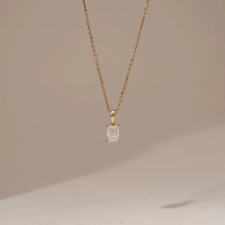 Front view of Minimal Emerald Cut Diamond Pendant in 14KT Yellow Gold, featuring a single emerald-cut lab-grown diamond.