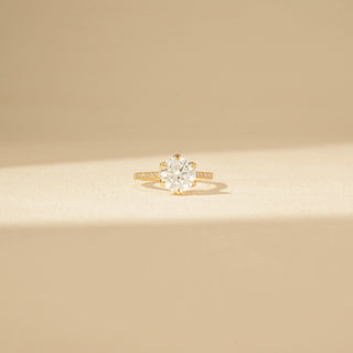 Front view of Classic Solitaire Diamond Ring in 14KT Yellow Gold, featuring a round brilliant-cut diamond and pavé-set band.