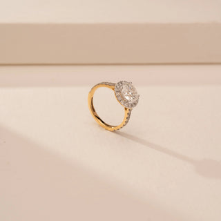 Angled view of Exquisite Round Halo Diamond Ring in 14KT Yellow Gold, featuring a round-cut lab-grown diamond.