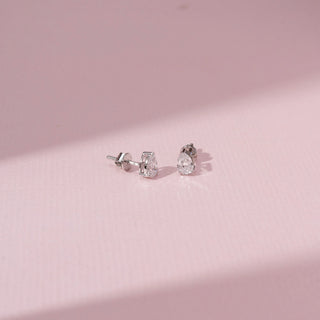 Angled view of Pear Cut Diamond Stud Earrings in 14KT White Gold, featuring pear-shaped lab-grown diamonds.