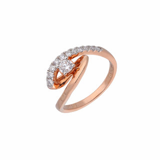 A close-up side view of a 14 KT rose gold ring of size 13.5, on a white background, featuring an asymmetrical twist design with one side of the band having lab grown round cut diamonds in prong setting with a total of 0.429 carat that curve into a loop and weighing 3.61 grams making it simple and unique for any occasion and everyday wear.