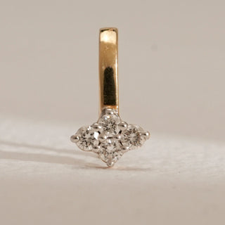 Close-up of Petite Sparkling Diamond Nose Pin in 14KT Yellow Gold, set with EF VVS round diamonds in a delicate cluster design, radiating timeless elegance and everyday brilliance.
