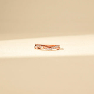 Front view of Intertwined Diamond Ring in 14KT Rose Gold, featuring crossing bands with pavé-set diamonds.