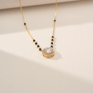 Angled view of Elegant Round Halo Diamond Mangalsutra in 14KT Yellow Gold, featuring a round lab-grown diamond with a diamond halo.