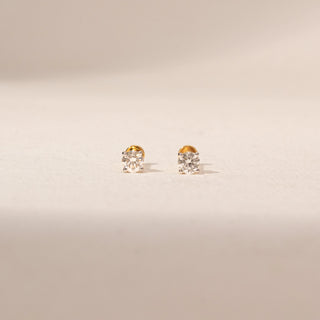 Front view of Round Solitaire Diamond Earrings in 14KT Yellow Gold, featuring brilliant round lab-grown diamonds.
