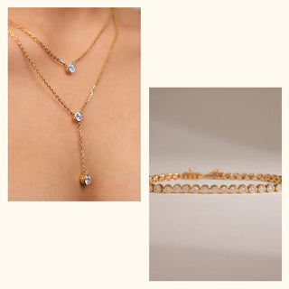 Layered lab-grown diamond necklace with bezel-set round accents paired with a matching tennis-style bracelet by Réia, shown as a neck-worn detail and a clean product close-up on a neutral surface in soft light.
