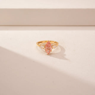 Front view of a 14KT Yellow Gold diamond ring featuring marquise-cut pink centre diamond..