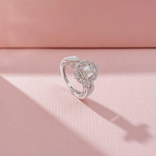 Angled view of Floral Emerald-Cut Diamond Ring in 14KT White Gold, featuring an emerald-cut centre diamond and floral halo.