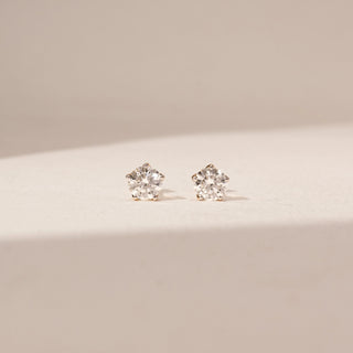 Front view of Round Diamond Stud Earrings in 14KT Yellow Gold, featuring matching round lab-grown diamonds in prong settings.