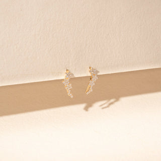 Side view of floral diamond earrings in 14KT yellow gold, featuring clustered round lab-grown diamonds in a delicate vine design.