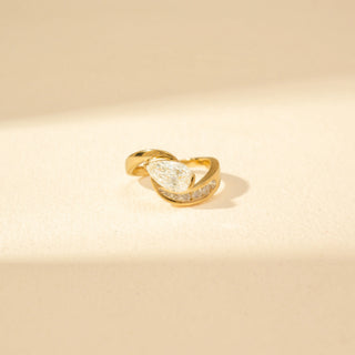 Close-up view of Curved Solitaire Diamond Open Ring in 14KT Yellow Gold, featuring a round diamond and pavé curved band.