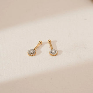 Angled view of yellow gold floral diamond koppu featuring clustered round lab-grown diamonds forming a sunburst bloom, set on elongated gold stems against a soft neutral background.