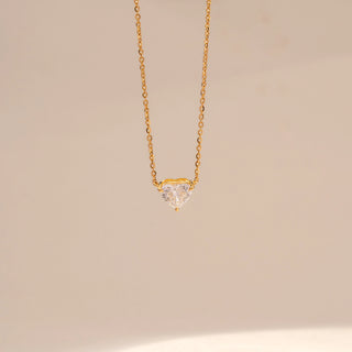 Close-up view of Round Solitaire Diamond Ring in 14KT Yellow Gold, featuring a round centre diamond and pavé-set band.