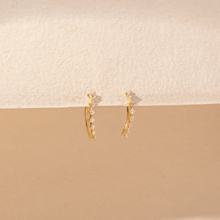 Side view of Curved Drop Diamond Earrings in 14KT Yellow Gold, featuring round diamonds in a graceful cascading design.