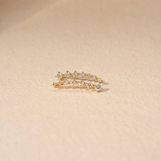 Close-up view of Curved Drop Diamond Earrings in 14KT Yellow Gold, featuring round diamonds in a graceful cascading design.