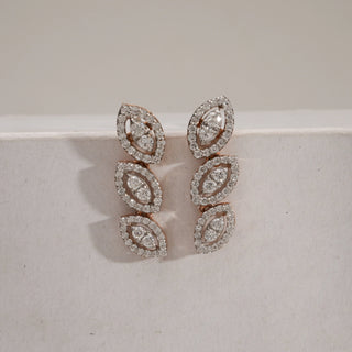 Front view of Triple Marquise Diamond Drop Earrings in rose gold with a push-pull mechanism. Each earring displays three vertically aligned marquise diamond clusters, set in pavé halos, crafted with EF colour, VVS clarity diamonds. Product weighs 4.12 grams with 1.21 carats of diamonds, in the INR 50,000–1,00,000 price range.