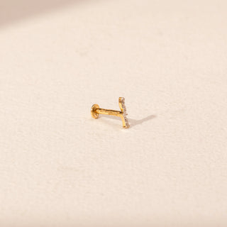 Angled view of Sunburst Diamond Nosepin in 14KT Yellow Gold, featuring a round lab-grown diamond and gold rays.