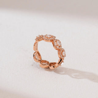 Angled side view of Geometric Alternating Halo Diamond Ring in 14KT Rose Gold, showcasing emerald-cut and round diamonds framed by pavé halos in a continuous alternating eternity band design.