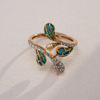 Close-up top view of Emerald Enamel Leaf Diamond Ring in 14KT Yellow Gold, accented with EF VVS round diamonds, green enamel leaf motifs, and a delicate pearl detail.