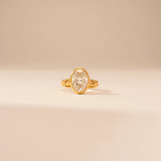 Front view of Vintage Oval Halo Diamond Ring in 14KT Yellow Gold, featuring an oval lab-grown diamond with a halo.