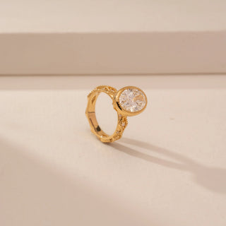 Angled view of Vintage Oval Halo Diamond Ring in 14KT Yellow Gold, featuring an oval lab-grown diamond with a halo.