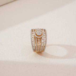 Top angled view of Grand Multi Row Diamond Band in yellow gold, showcasing layered rows of round lab-grown diamonds with a raised circular centre cluster, displayed on a neutral background.