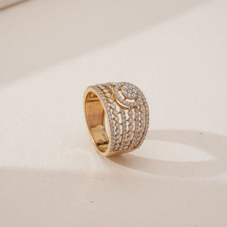 Side angled view of Grand Multi Row Diamond Band in yellow gold, featuring layered rows of round lab-grown diamonds with a raised circular centre cluster, displayed on a neutral surface.