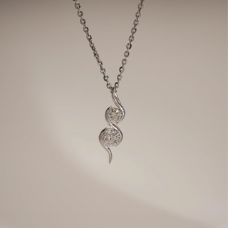 Front view of Whimsical S-Curve Diamond Necklace against beige background. Made in 14KT hallmarked white gold, size 16 inches, adorned with EF VVS lab grown diamonds weighing 0.72 carats, including a 0.47-carat solitaire. Weighs 3.399 grams, falls within INR 50,000–1,00,000.