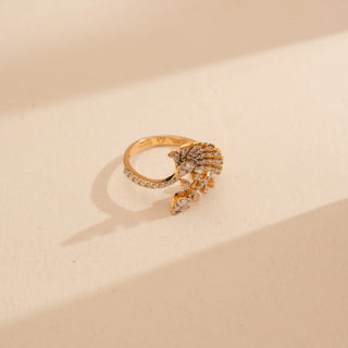 Top-down view of Reia’s 14 KT Yellow Gold Elegant Statement Branch Diamond Ring. Captured on a cream backdrop, it highlights the intricate, diamond-set branching motif and polished gold finish.
