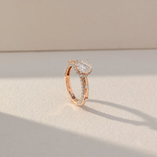 Side view of Round Halo Diamond Ring in 14KT Rose Gold, featuring a centred round lab grown diamond with halo and pavé-set band. Set on a beige backdrop, the design highlights depth and elegance.