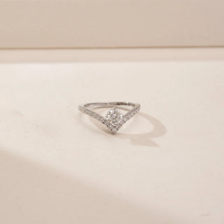 Front view of a 14KT White Gold diamond ring, featuring an oval centre diamond and a V-shaped diamond-set band.